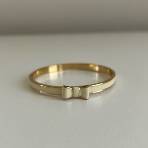 Kate Spade New York crème and gold bangle